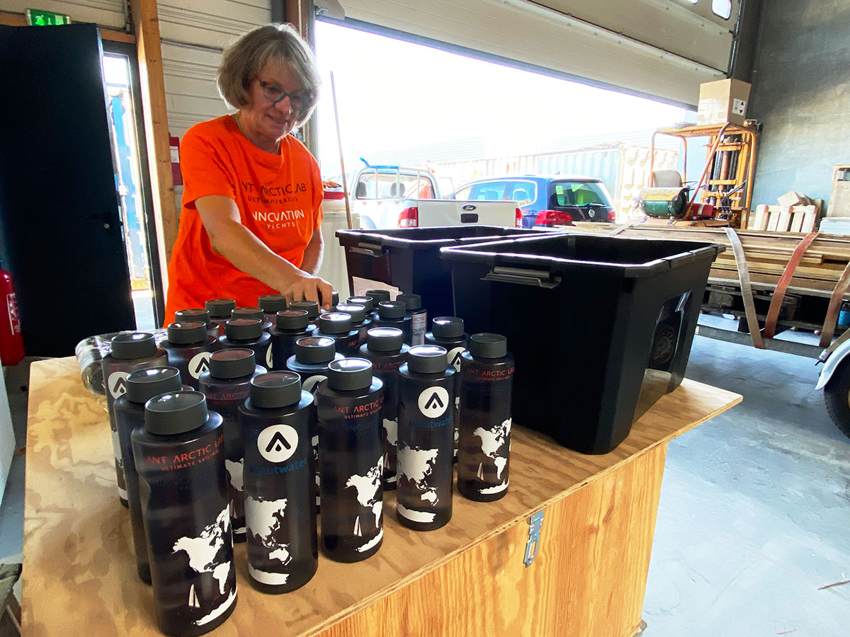 Our team, Rosemarie filling in (emergency) water into the bottles