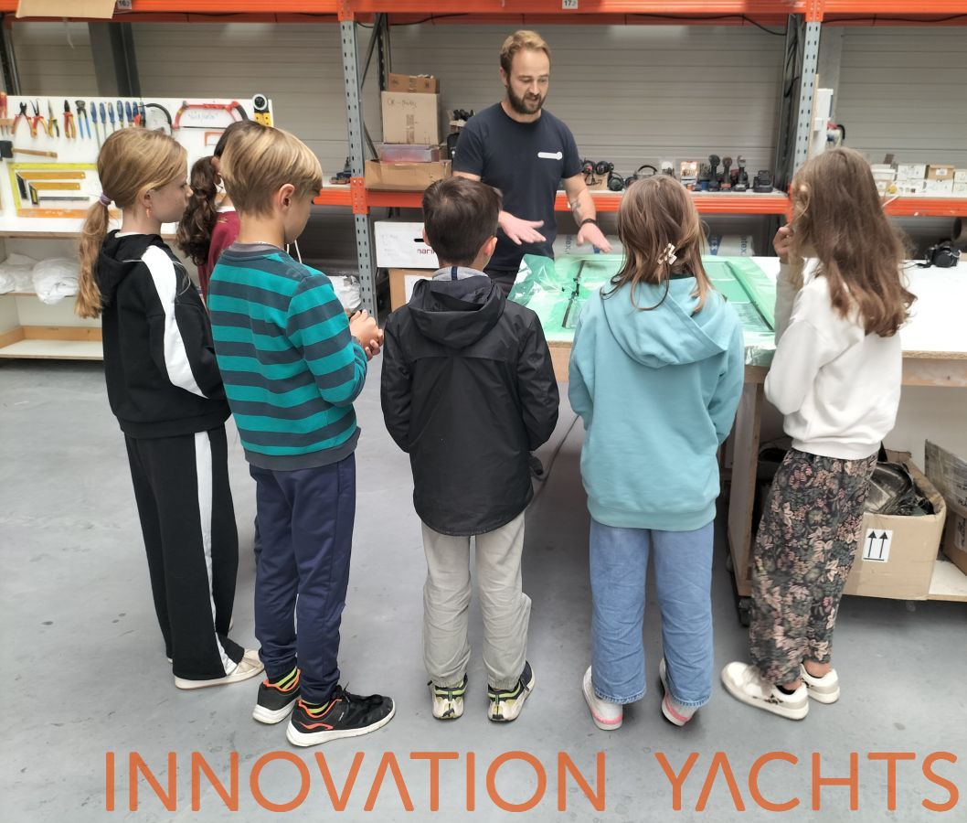 Group of children listening to an explanation of the result of a lamination
