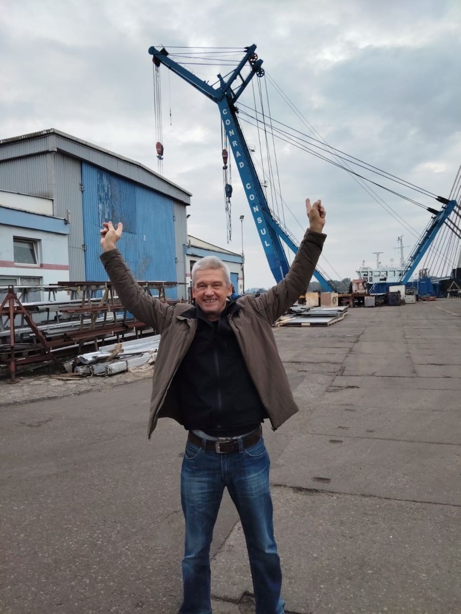 Norbert raises his arms in front of