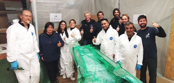 Team of the Skills Shadowing Workshop for TEcoNaut project behind the piece they laminated which is on vacuum