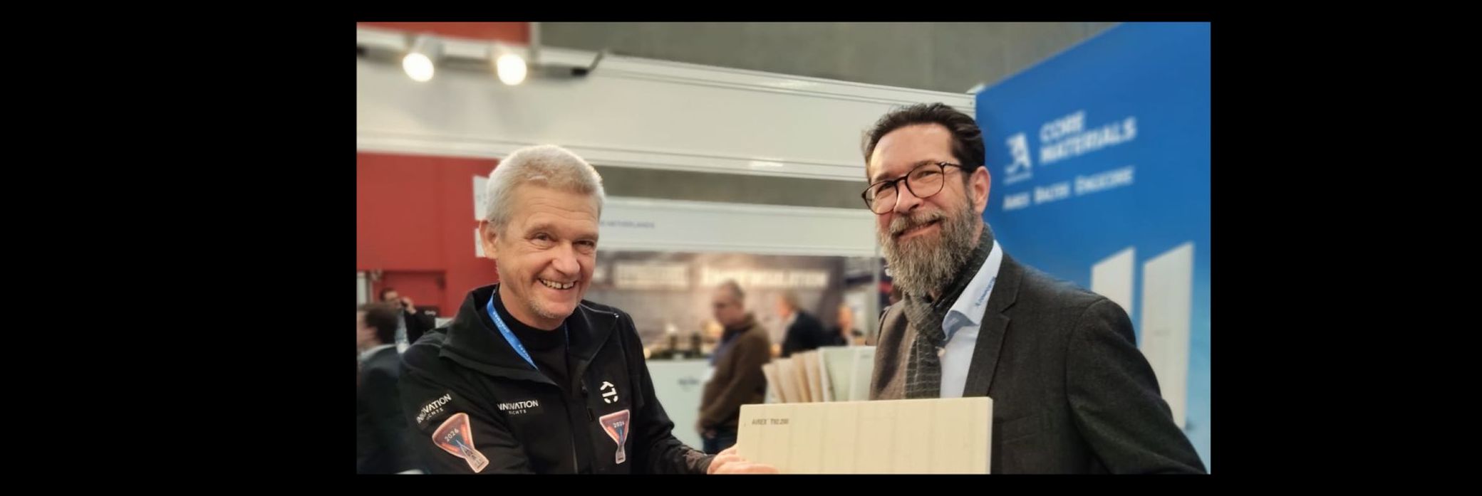 Norbert and a team member of 3A Composites presenting a sample of new Airex92