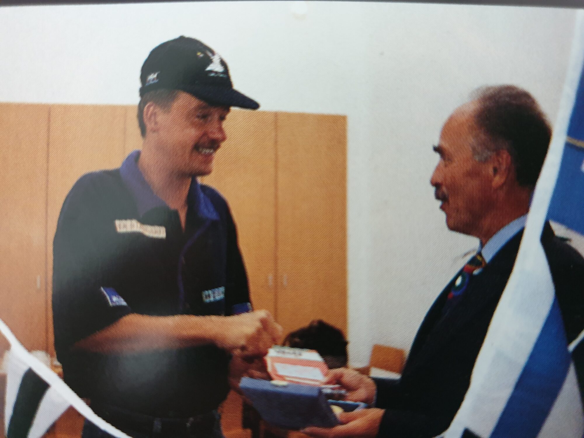 Norbert receiving the medal of honour from an Austrian official during his