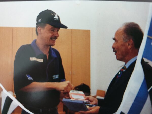 Norbert receiving the medal of honour from an Austrian official during his