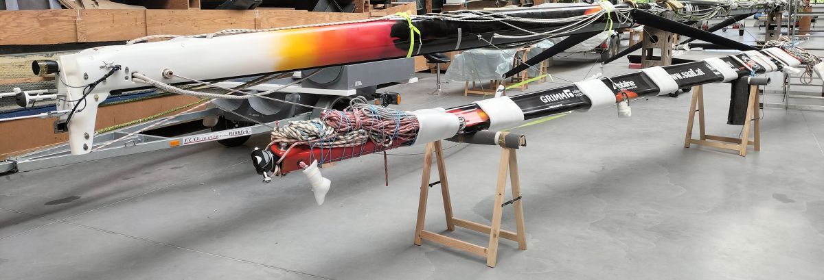 Mast and boom ready for transport, stored in the shipyard.