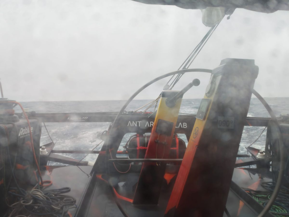 Stern of the Open60AAL in bad weather seen through the cockpit door. - ANT ARCTIC LAB